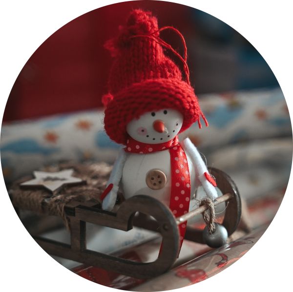Christmas snowman decoration with a red hat and scarf